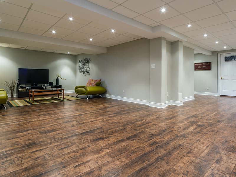 Basement room with laminate flooring installed by Orange Cat Flooring in Atlanta, GA.