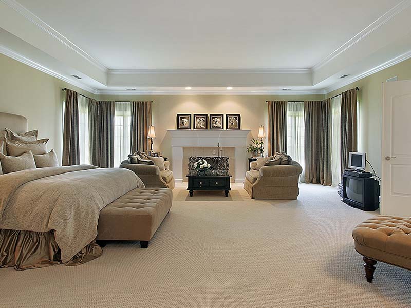 Elegant master bedroom with plush carpet flooring installed by Orange Cat Flooring in Atlanta, GA.