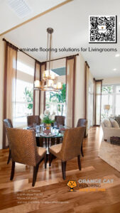 A beautifully designed living and dining area featuring laminate flooring. The image includes a QR code, the text "Laminate flooring solutions for Livingrooms," and Orange Cat Flooring's logo, contact information, and website.